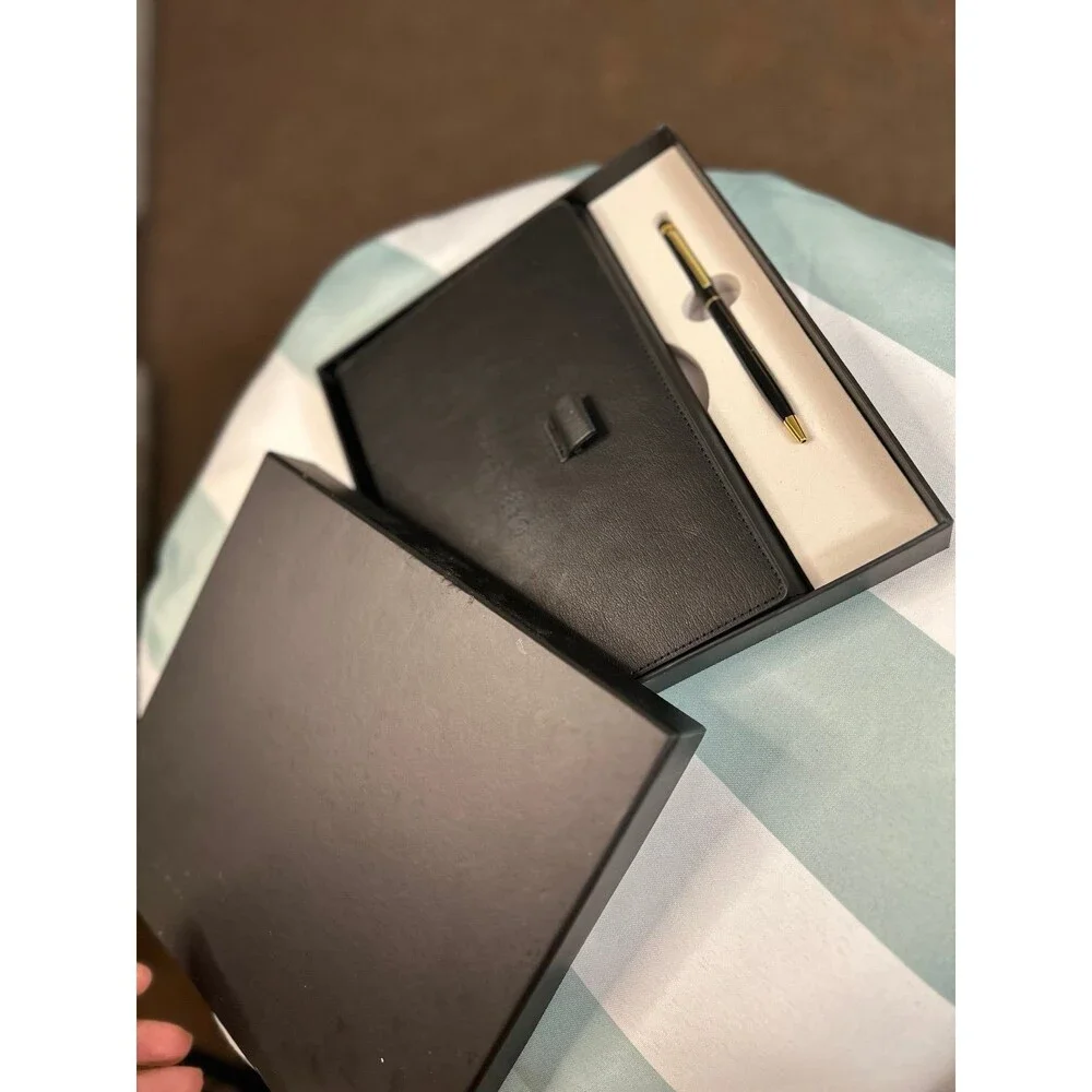 Black leather journal with pen